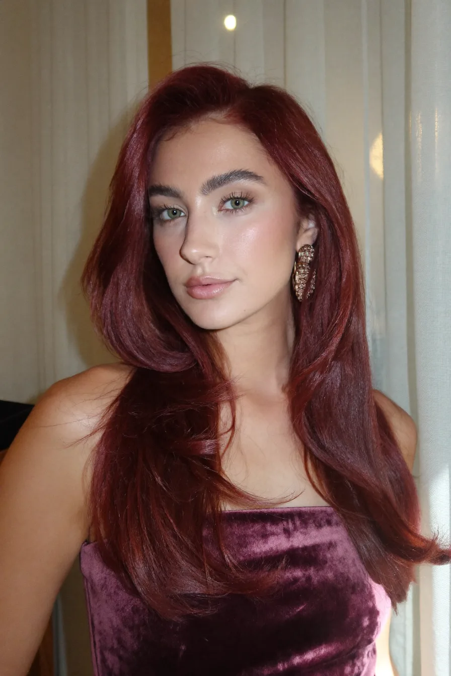 Long Layered Auburn Hair with a Side Part Style