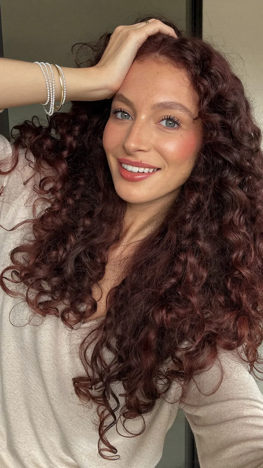 Voluminous Long Curly Auburn Hair with Natural Layering