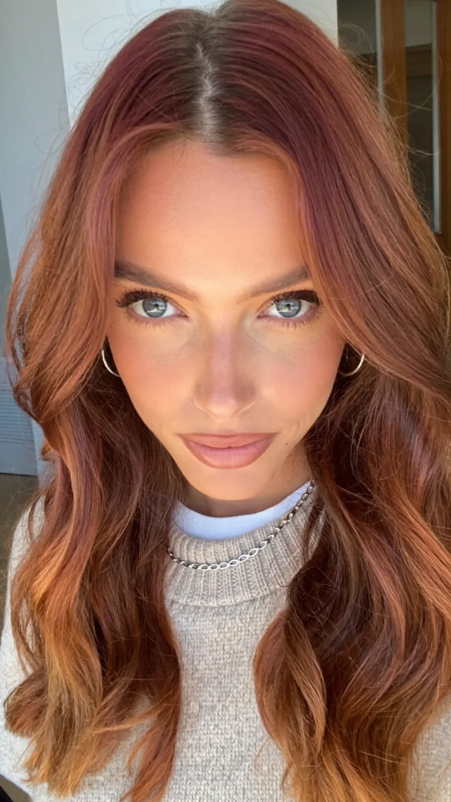 Elegant Warm Copper Long Layered Waves with Center Part