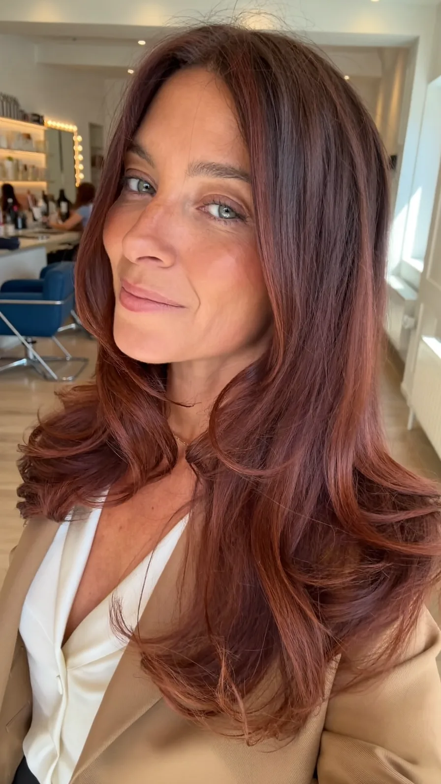 Elegant Long Layered Auburn Hair with Flowing Feathered Ends
