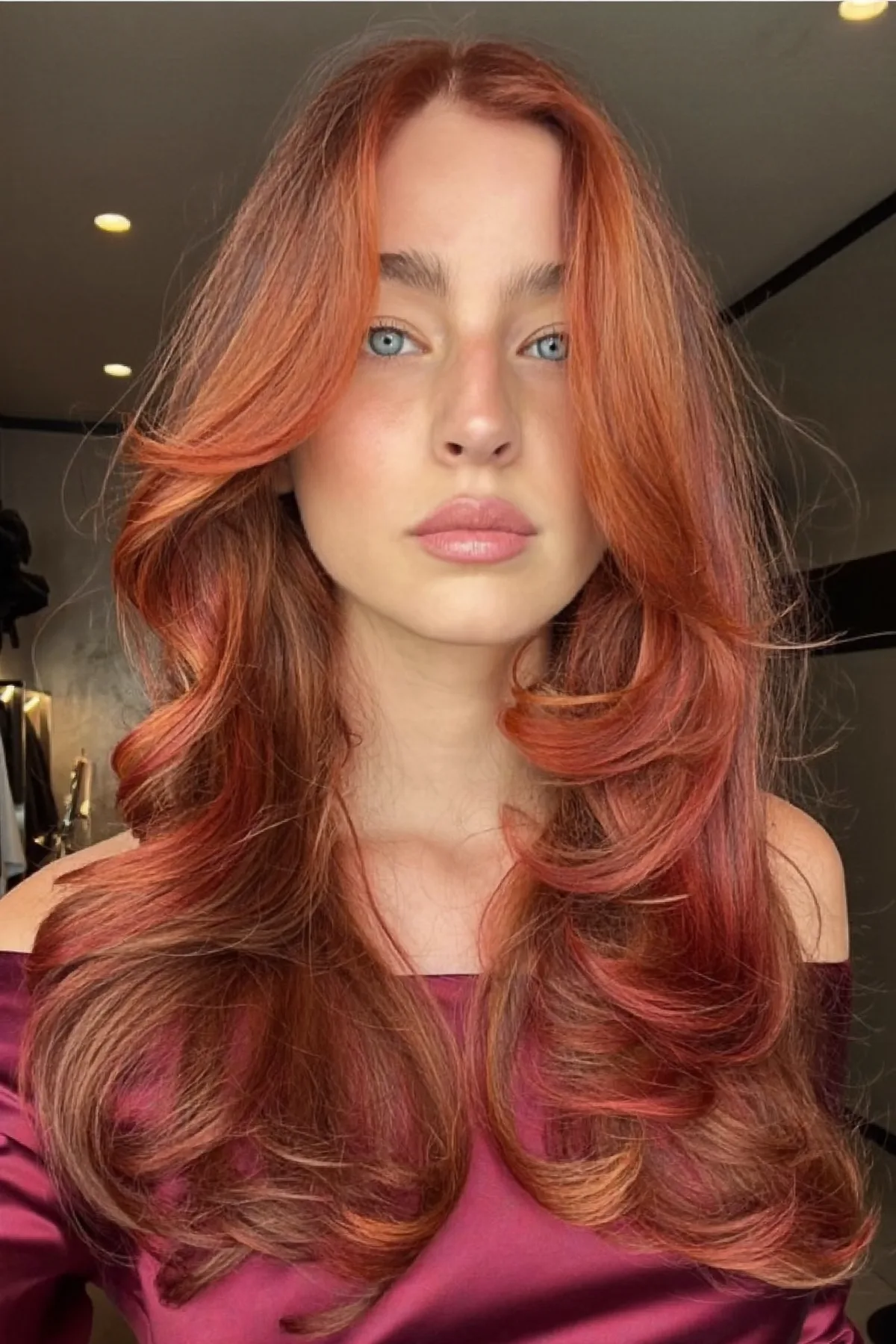 Auburn Copper Long Layered Cut with Curtain Bangs and Waves