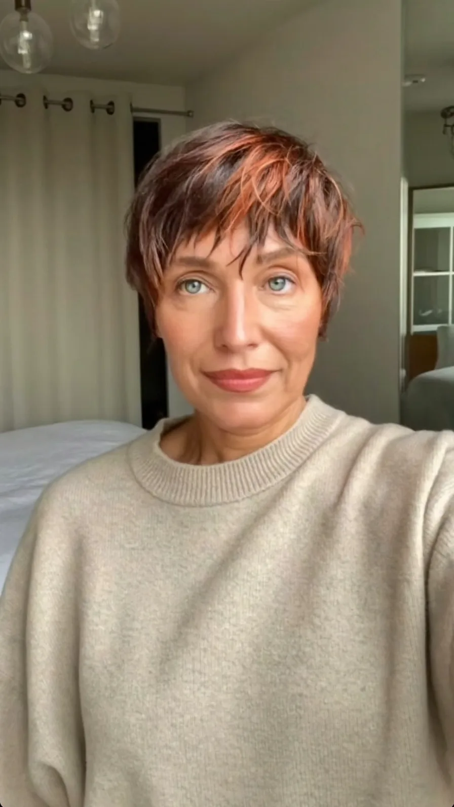 Textured Pixie Cut with Auburn Copper Highlights and Wispy Bangs