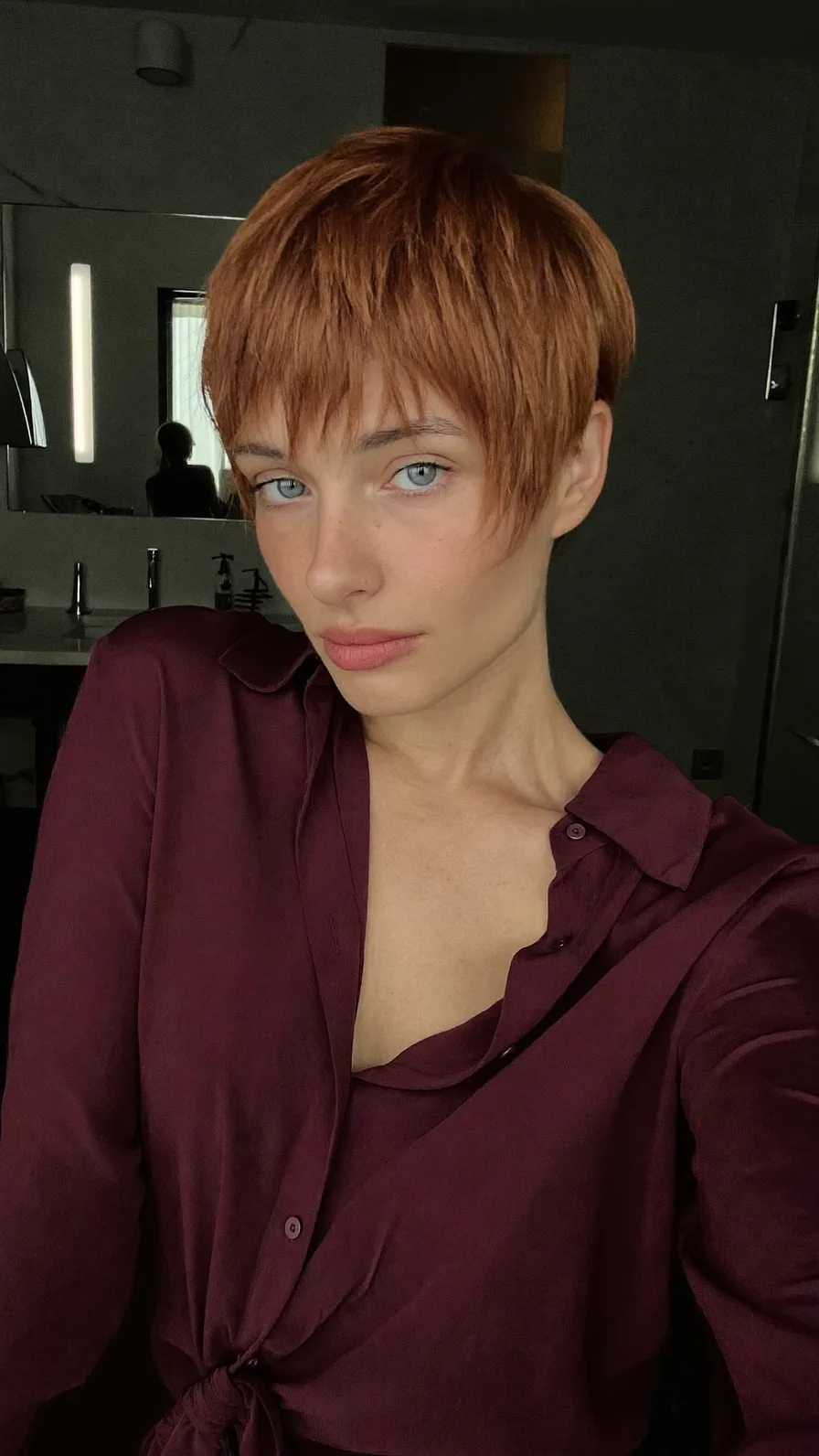 Textured Copper Pixie Cut with Wispy Side-Swept Bangs