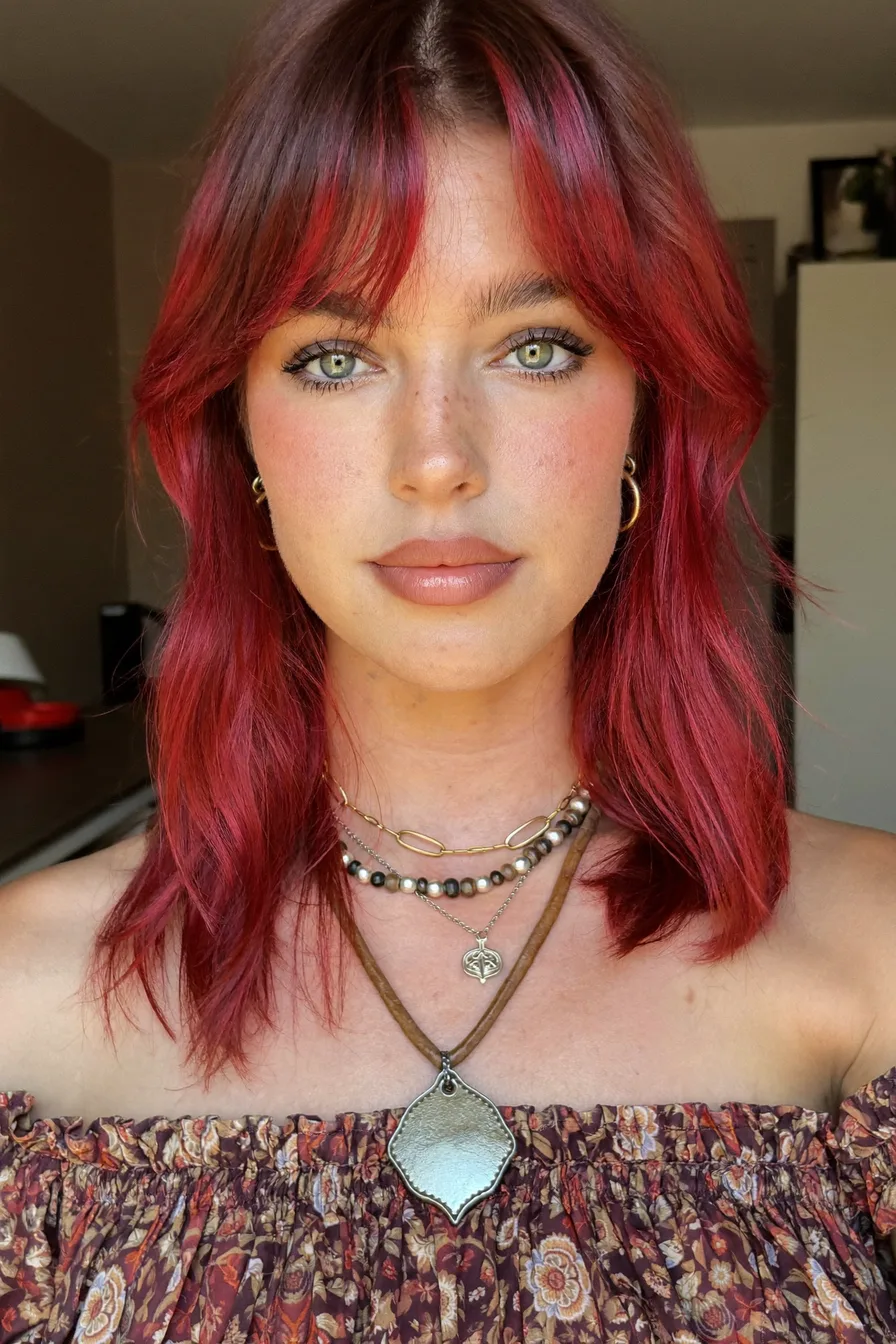 Shaggy Layered Cut with Auburn Red Tones and Curtain Bangs