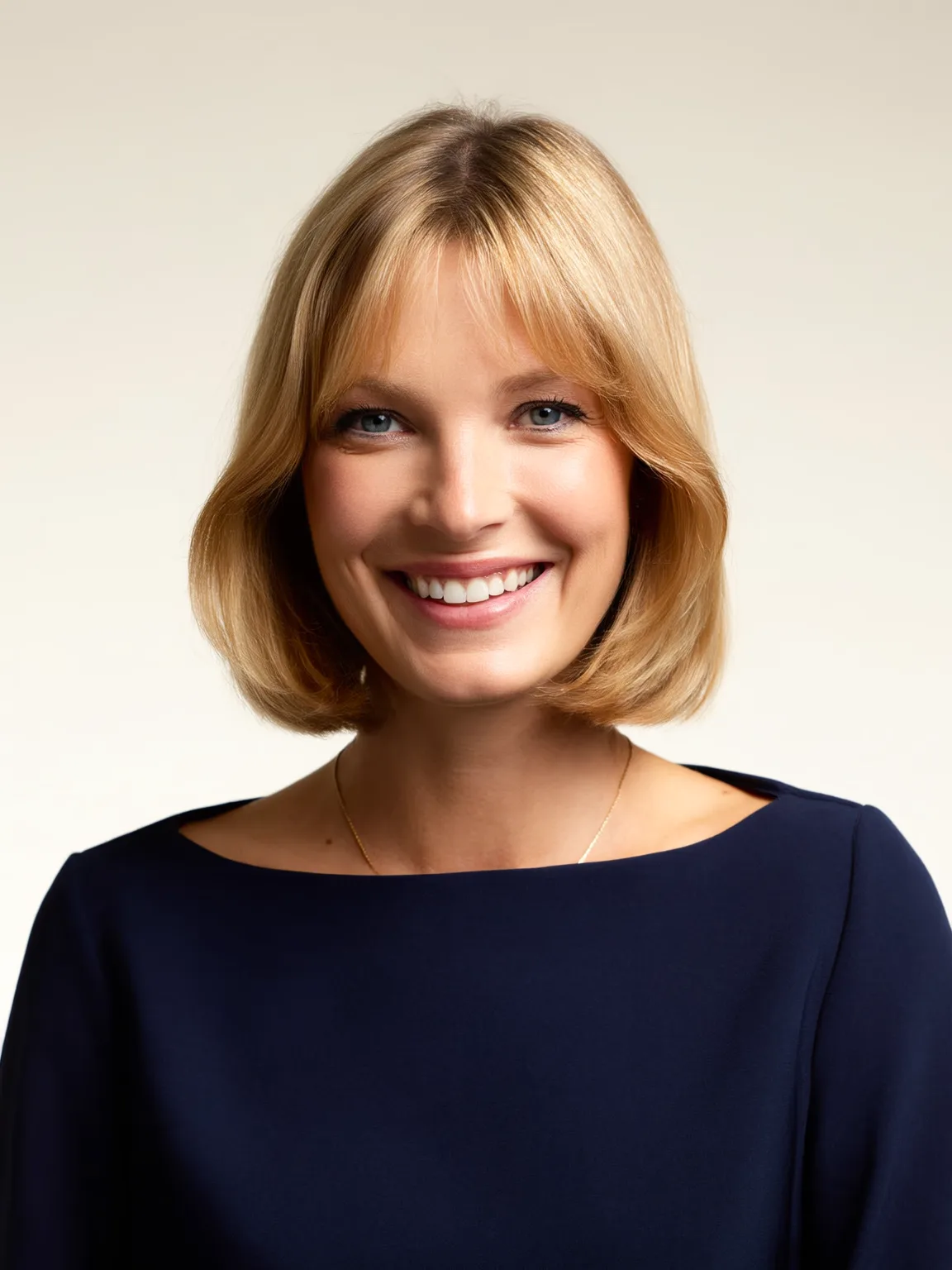 Straight Chin-Length Sandy Blonde Bob with Curtain Bangs