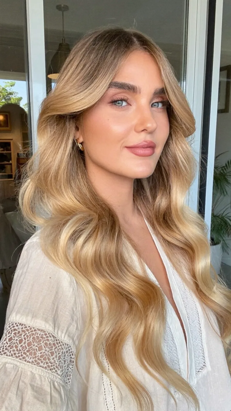 Voluminous Long Layers with Warm Honey Blonde Balayage