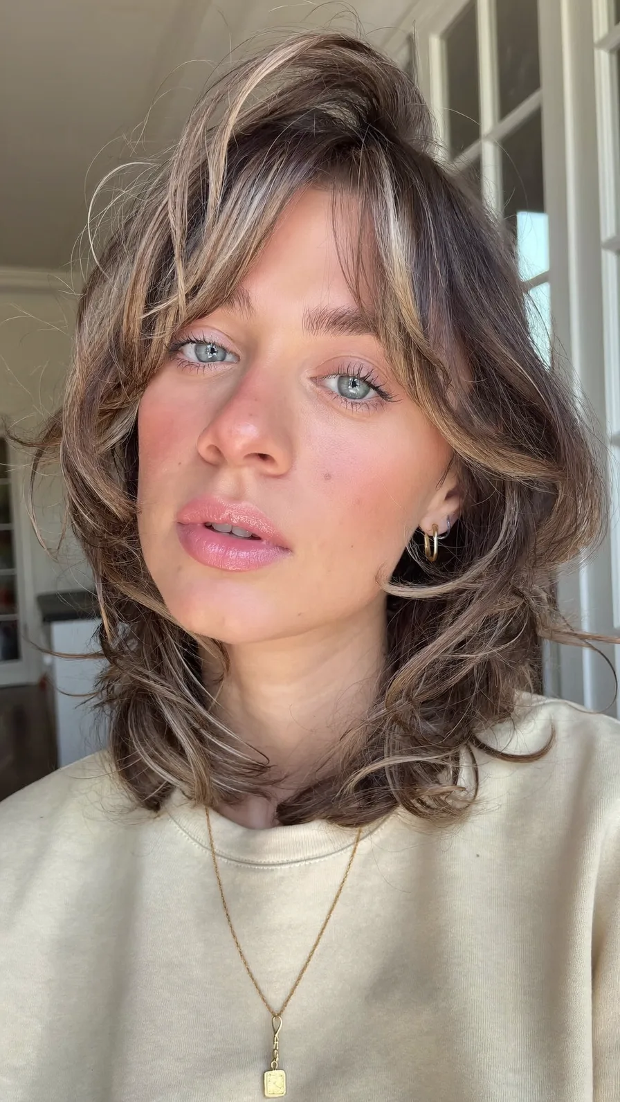 Modern Shoulder-Length Layered Hair with Balayage and Curtain Bangs