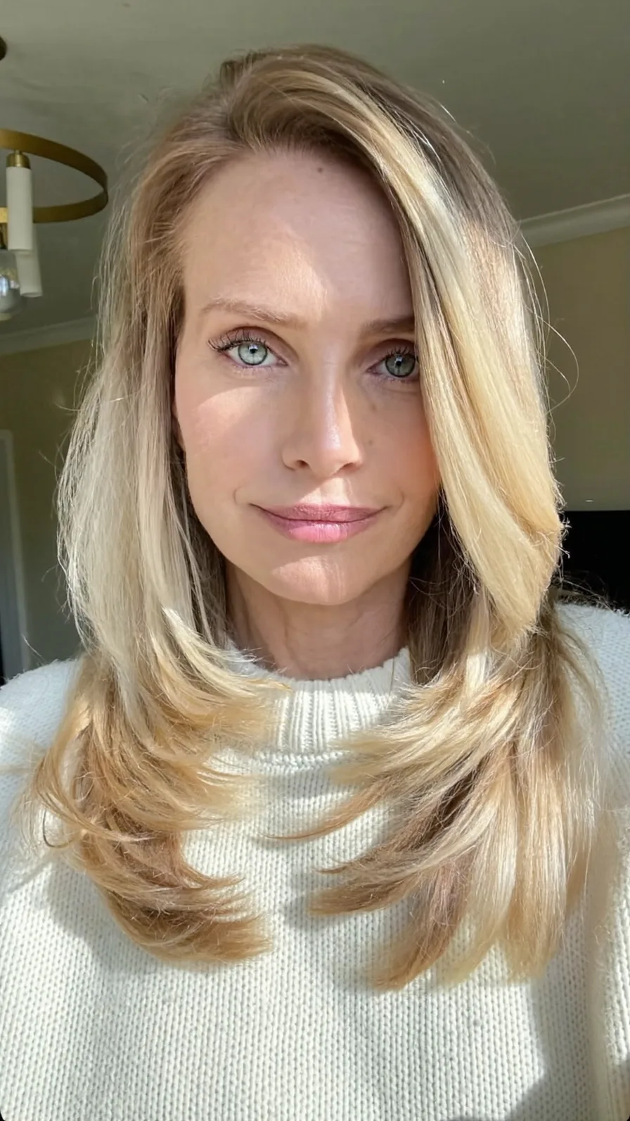 Classic Shoulder-Length Honey Blonde Layered Blowout