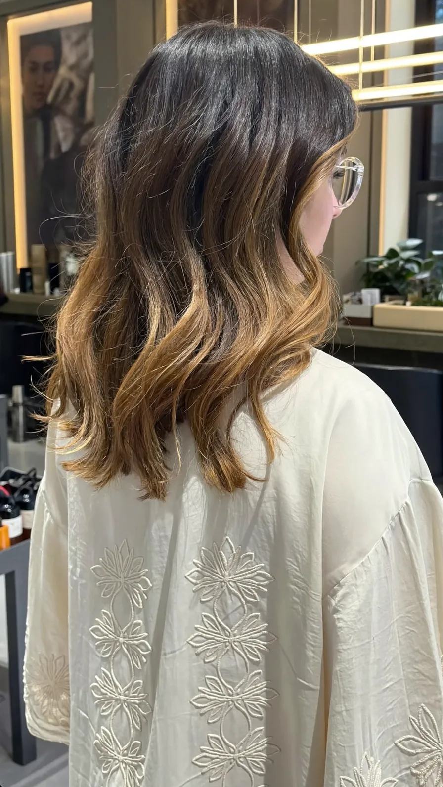 Modern Medium-Length Long Layers with Warm Caramel Balayage