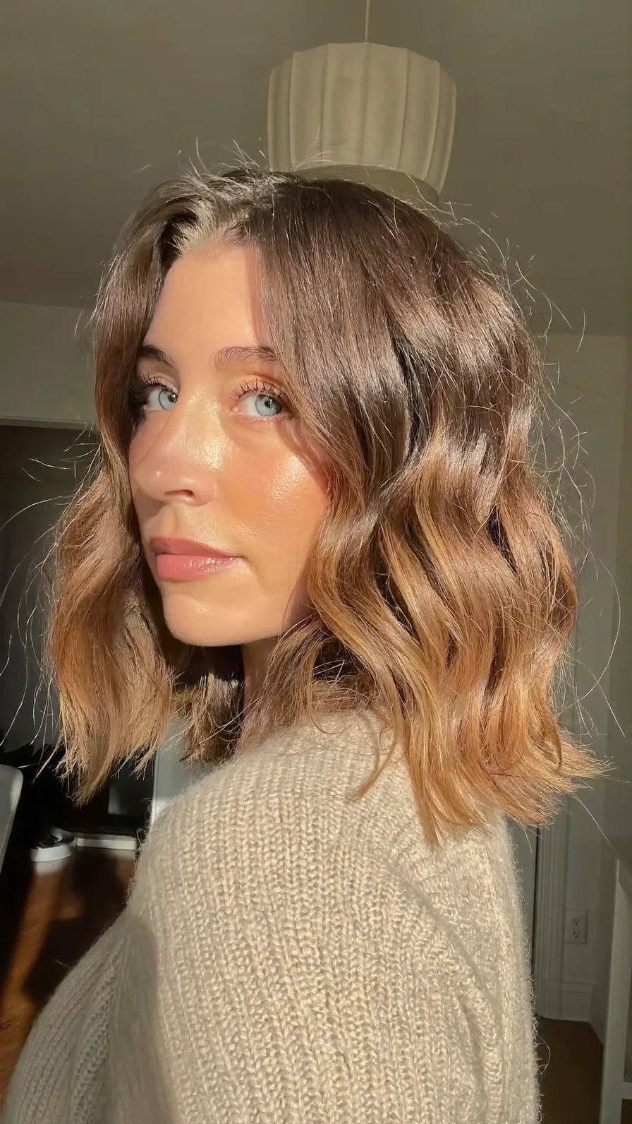 Soft Wavy Lob with Caramel Balayage and Curtain Bangs