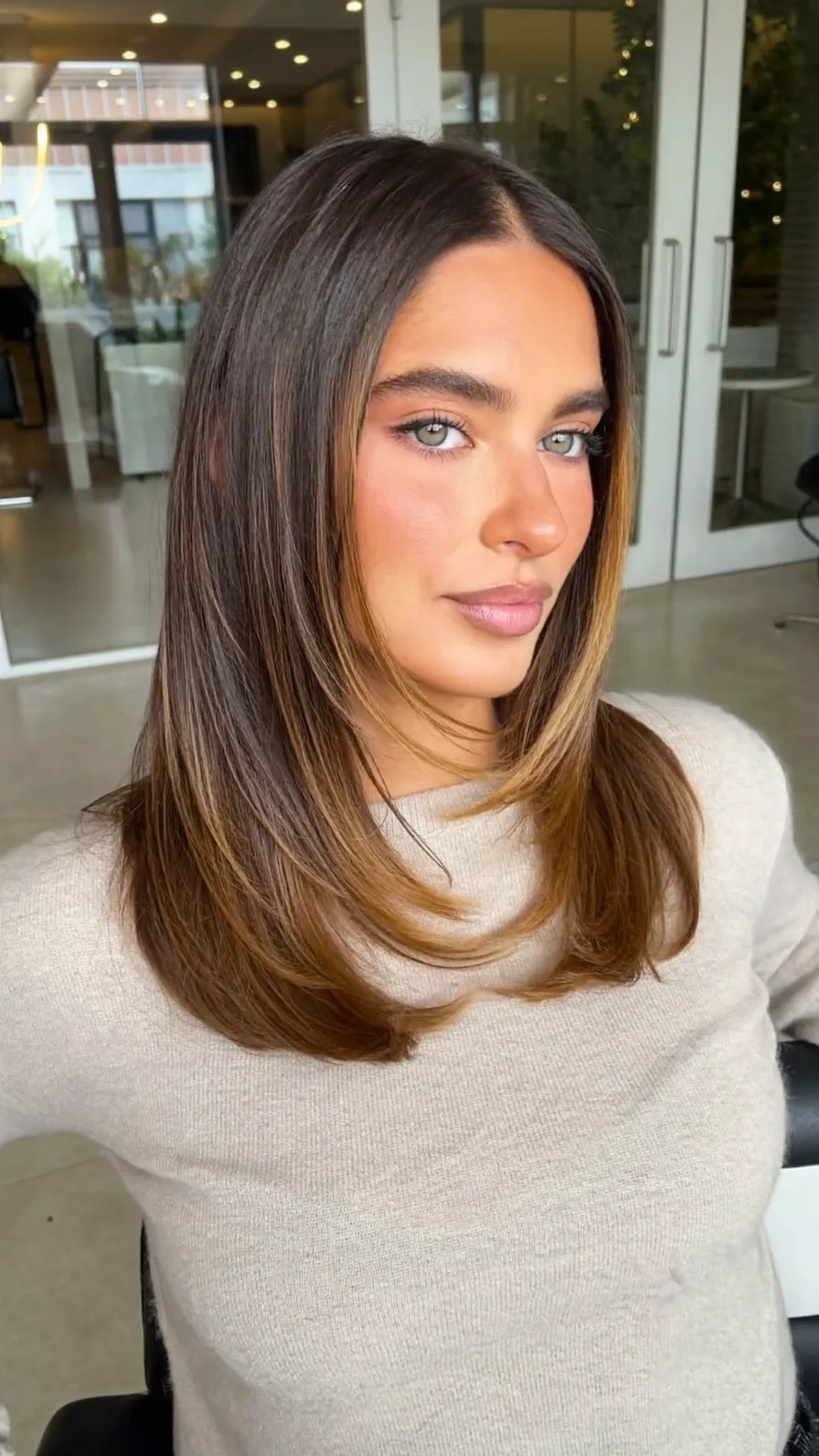 Medium Length Layered Hair with Warm Caramel Balayage Highlights