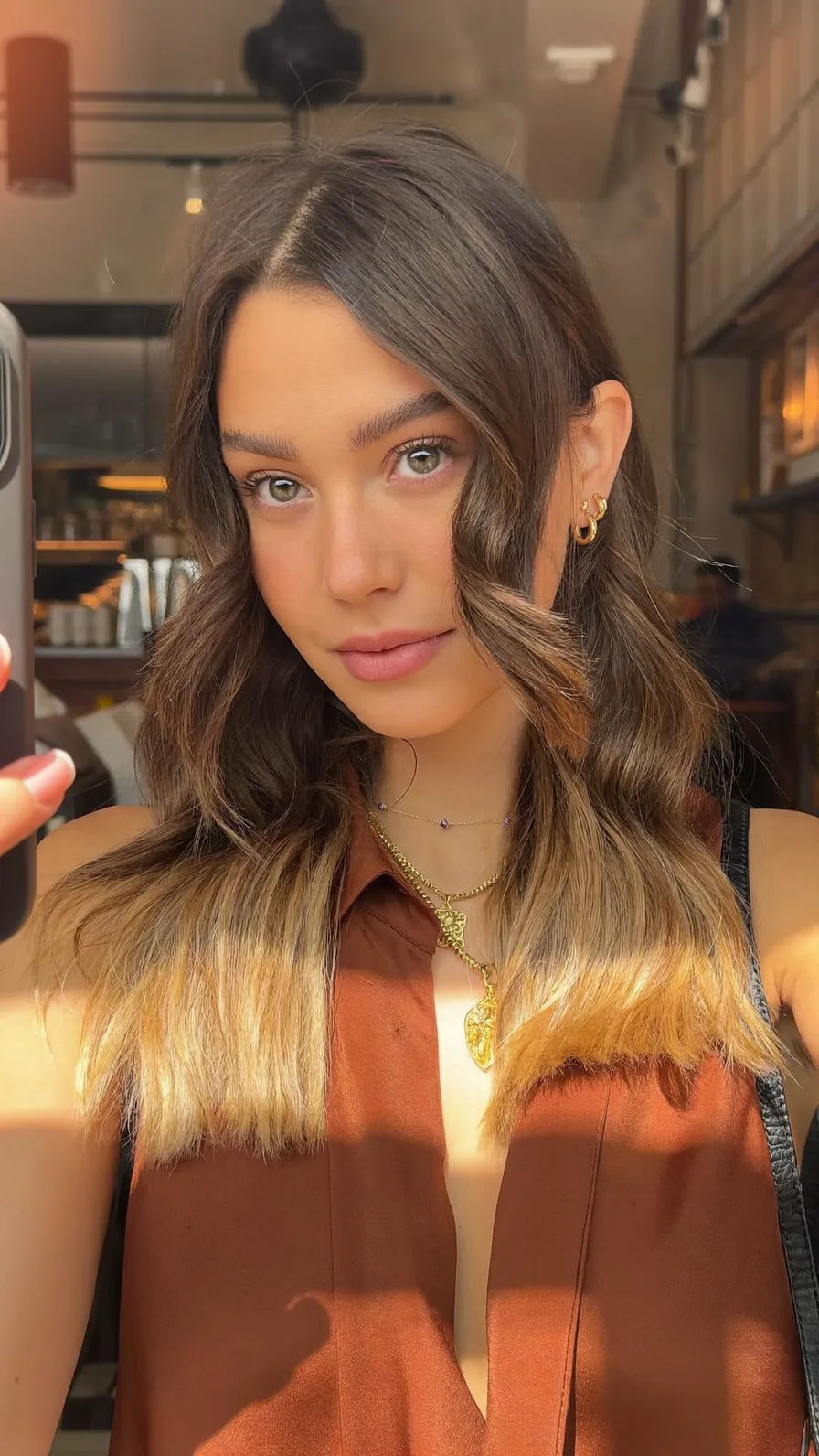Medium Wavy Hair with Honey Blonde Balayage and Curtain Bangs