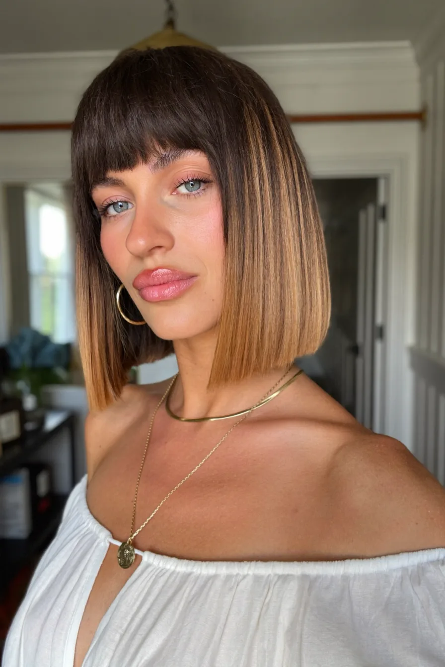 Sleek Blunt Bob with Caramel Balayage and Blunt Bangs