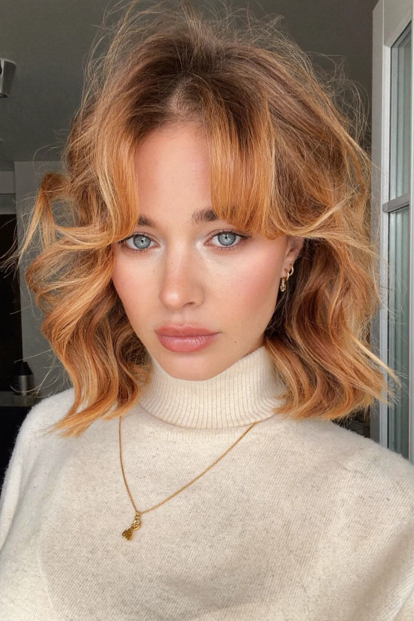 Jaw-Length Balayage Lob with Loose Waves and Centered Bangs