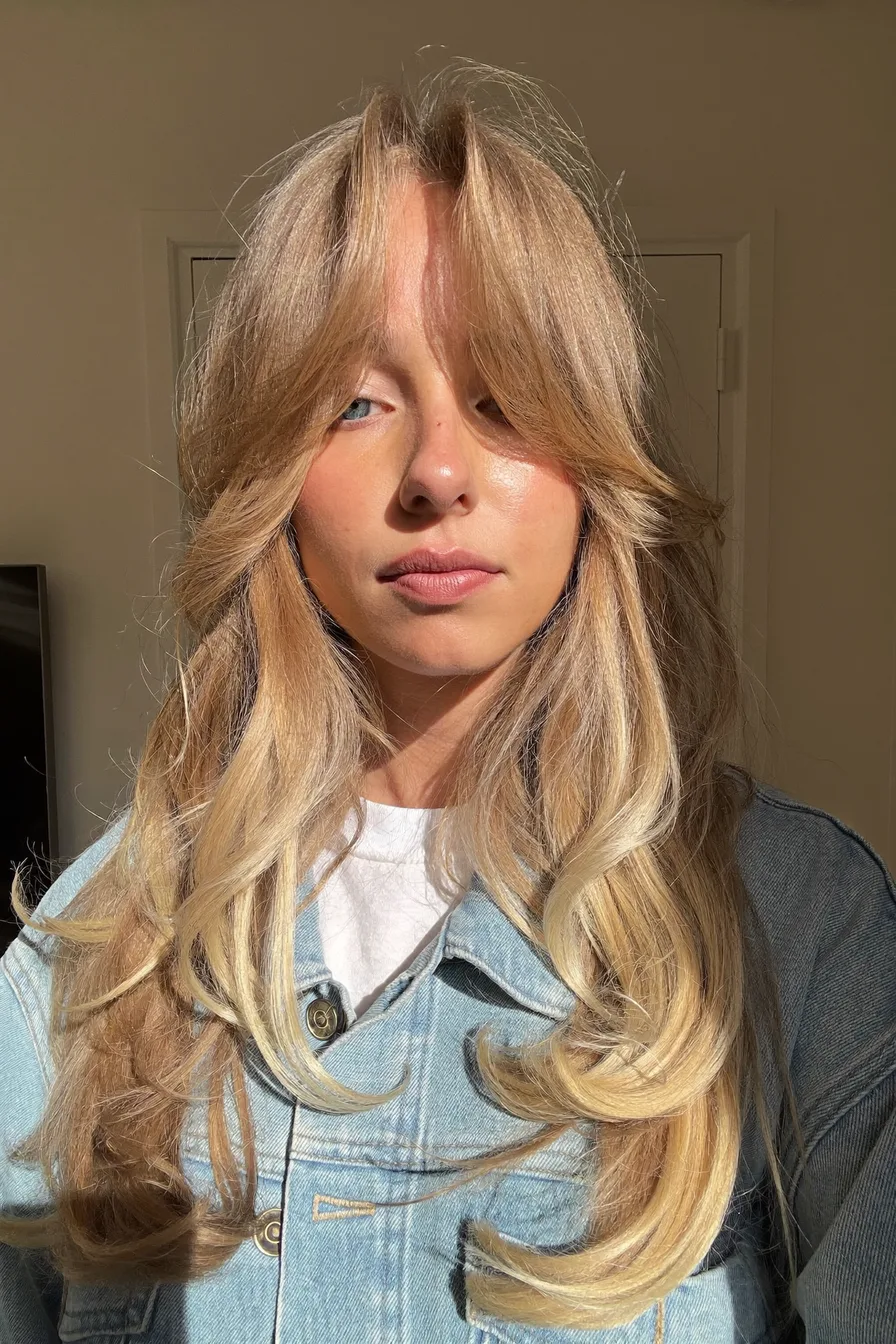 Soft Face-Framing Wavy Long Layered Haircut with Curtain Bangs