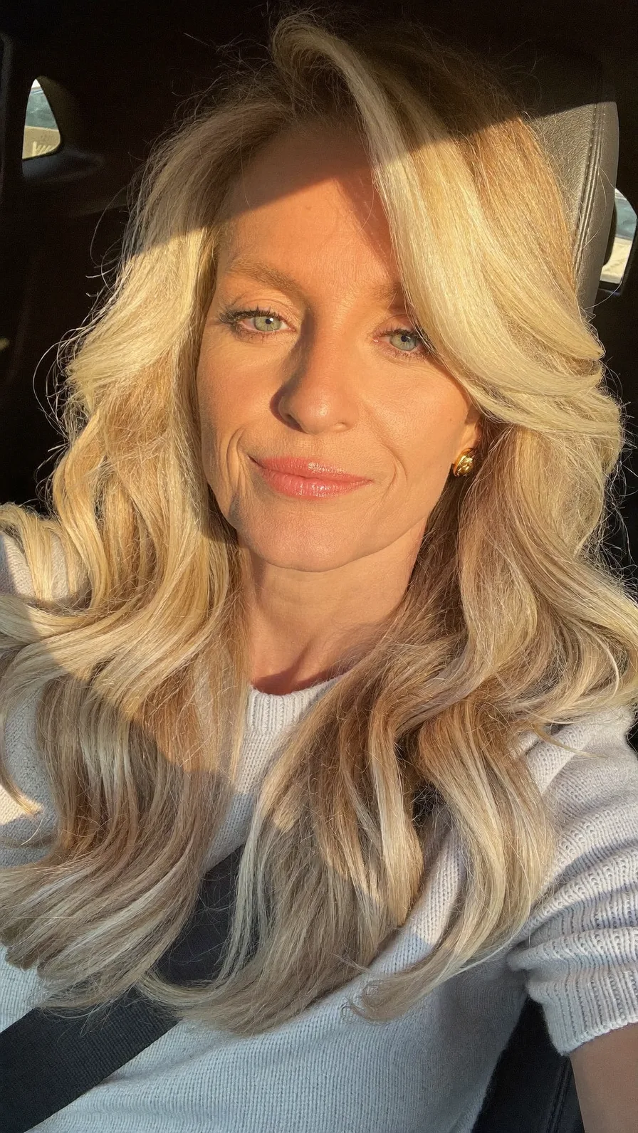 Voluminous Long Layered Waves with Side-Swept Platinum Blonde