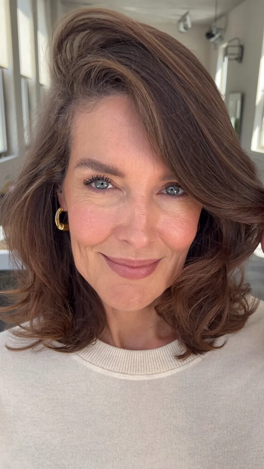 Voluminous Shoulder-Length Long Layered Hair with Side-Swept Bangs
