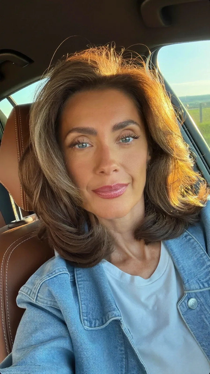 Voluminous Layered Blowout with Soft Side-Swept Bangs