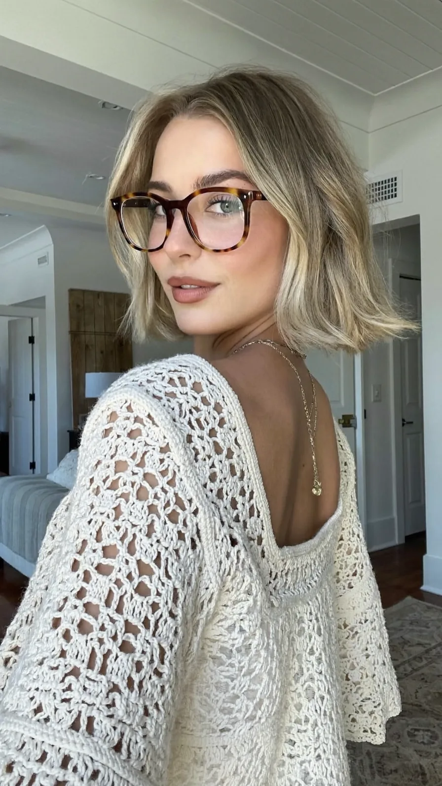 Chic Chin-Length Bob with Flicked Ends and Cool Ash Blonde