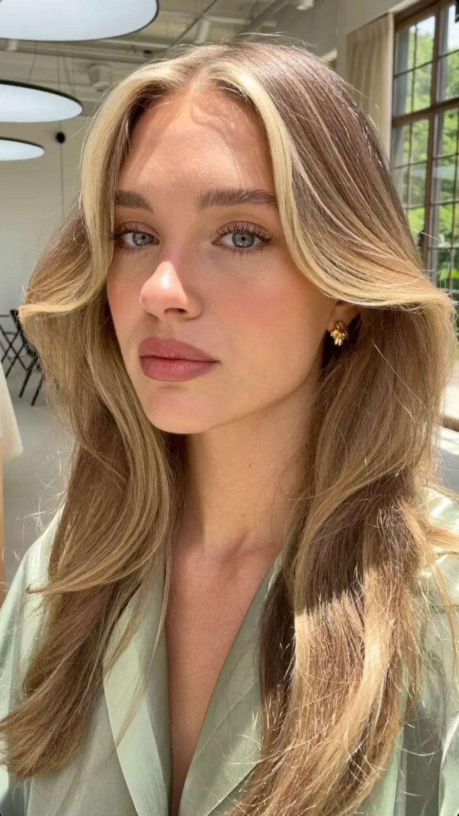 Long Layered Hair with Soft Curtain Bangs and Money-Piece Highlights