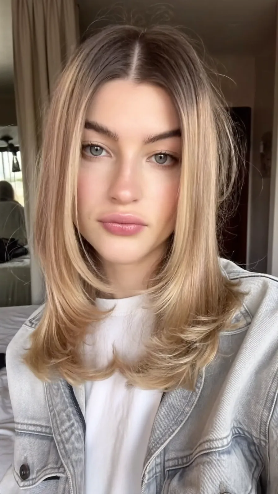 Modern Honey Blonde Shoulder-Length Layered Haircut