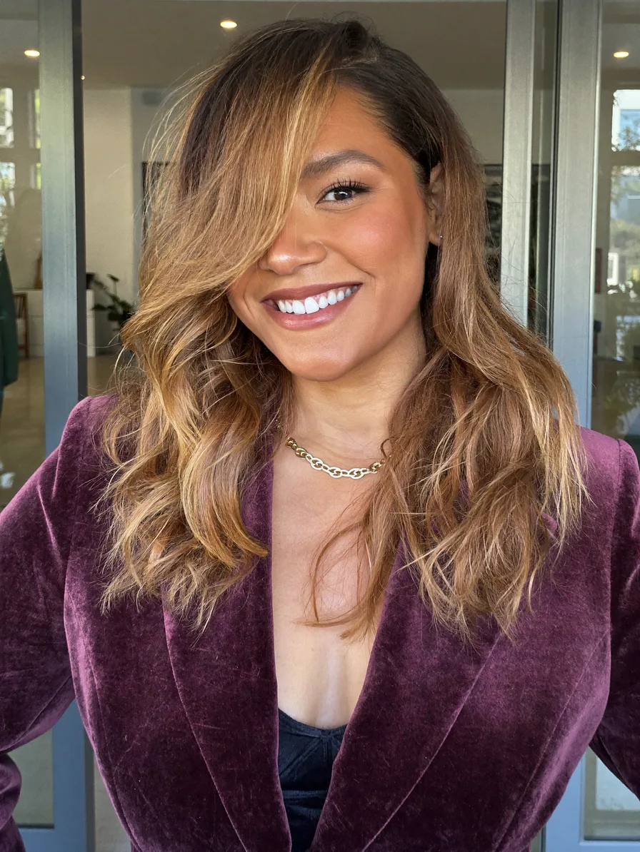 Flowing Long Layered Hair with Side-Swept Honey Blonde Balayage