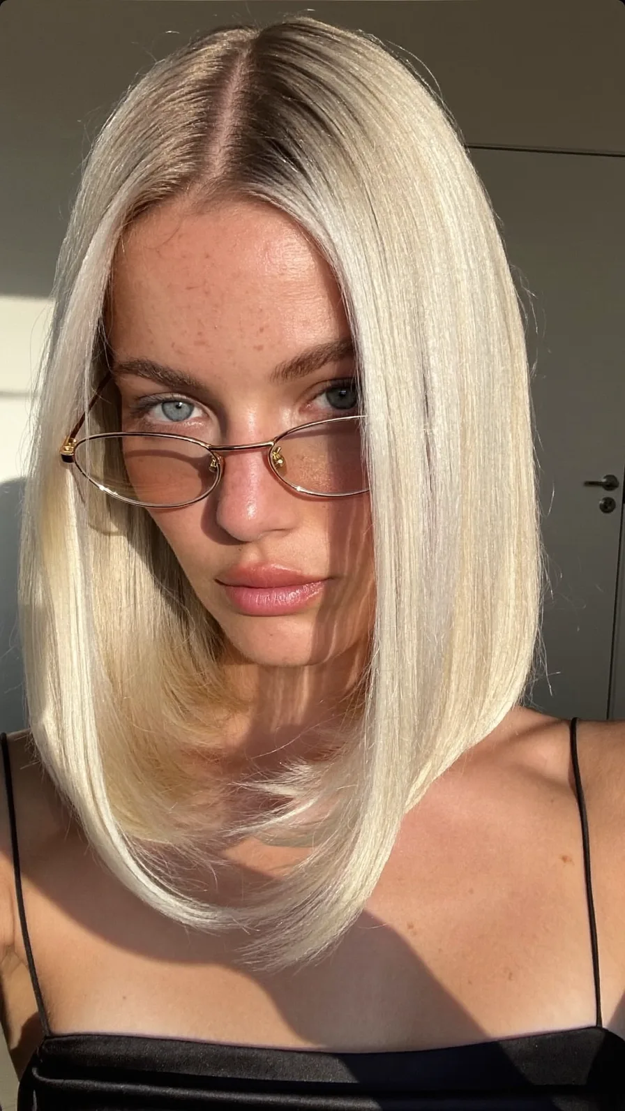 Sleek Shoulder-Length Platinum Blonde Blunt Long Bob