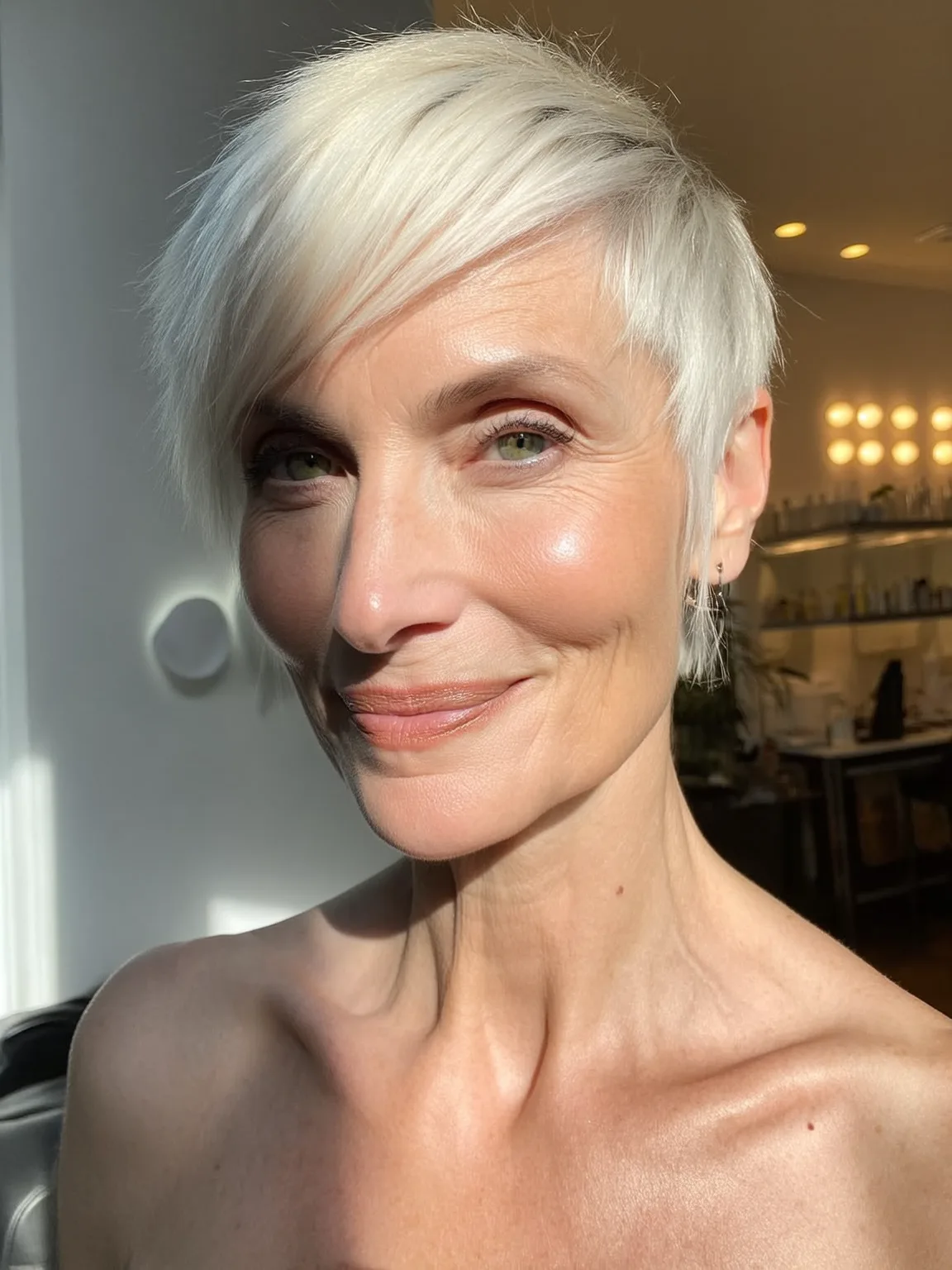 Sleek Platinum Blonde Pixie with Side-Swept Bangs on Oval Faces