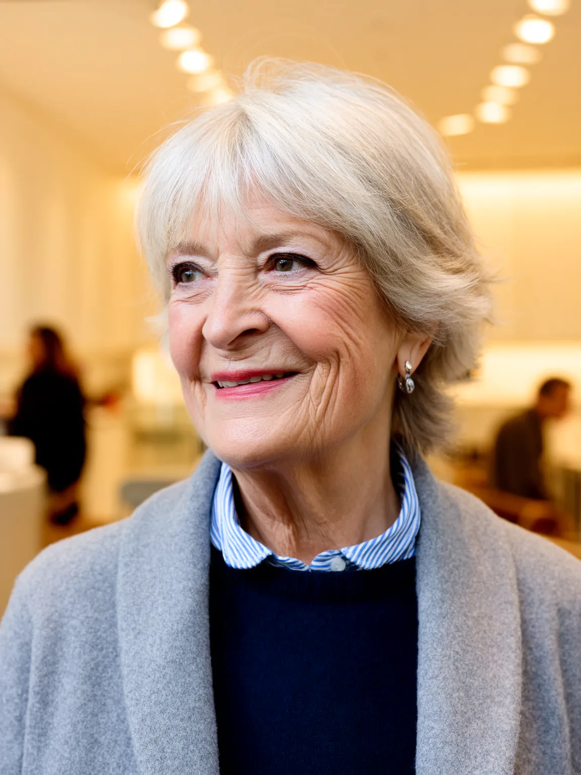 Shoulder-Length Wavy Silver Frost Bob with Bangs