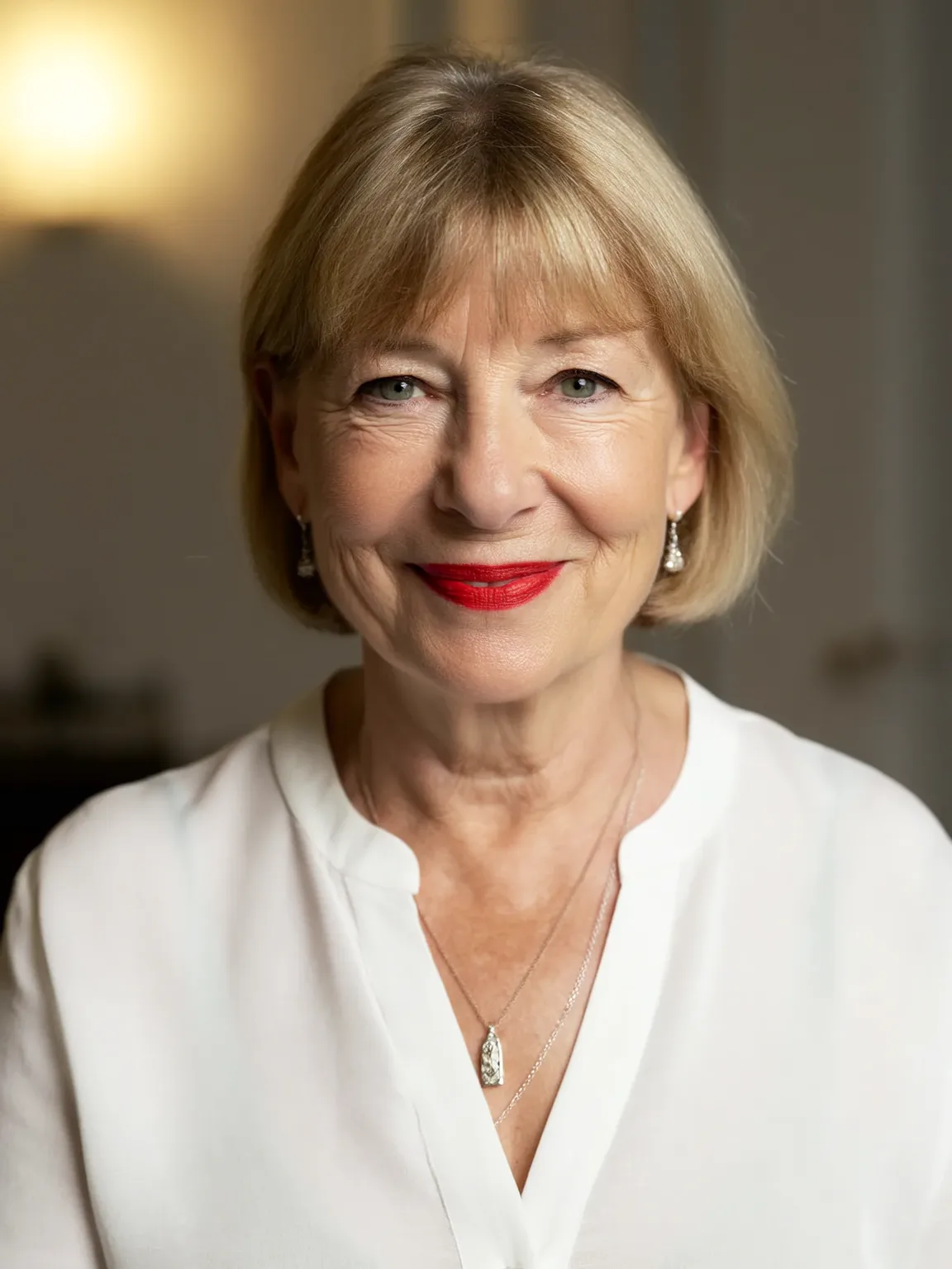 Sandy Blonde Chin-Length Bob with Polished Blunt Bangs