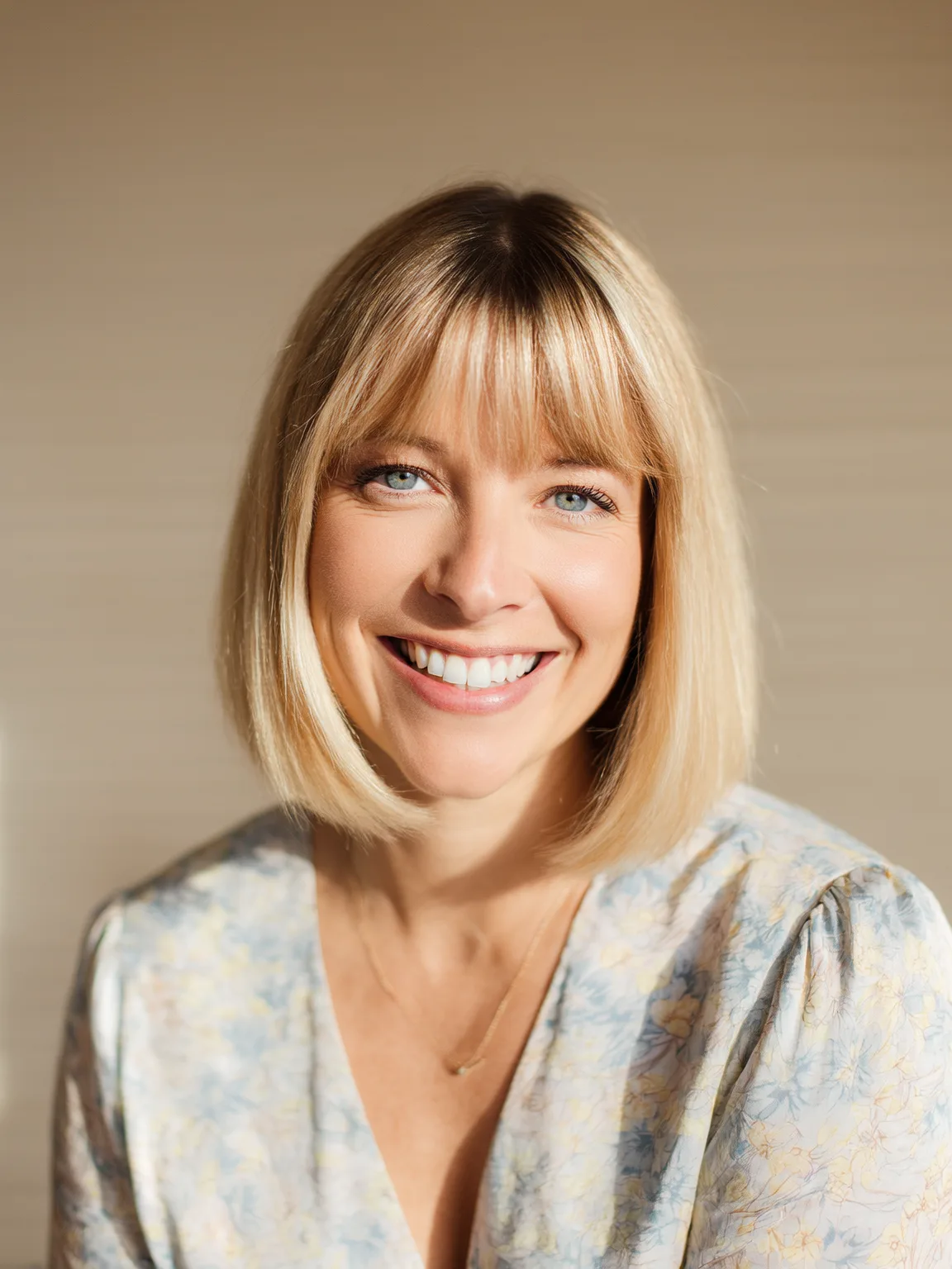 Honey Blonde Chin-Length Straight Bob with Defined Bangs