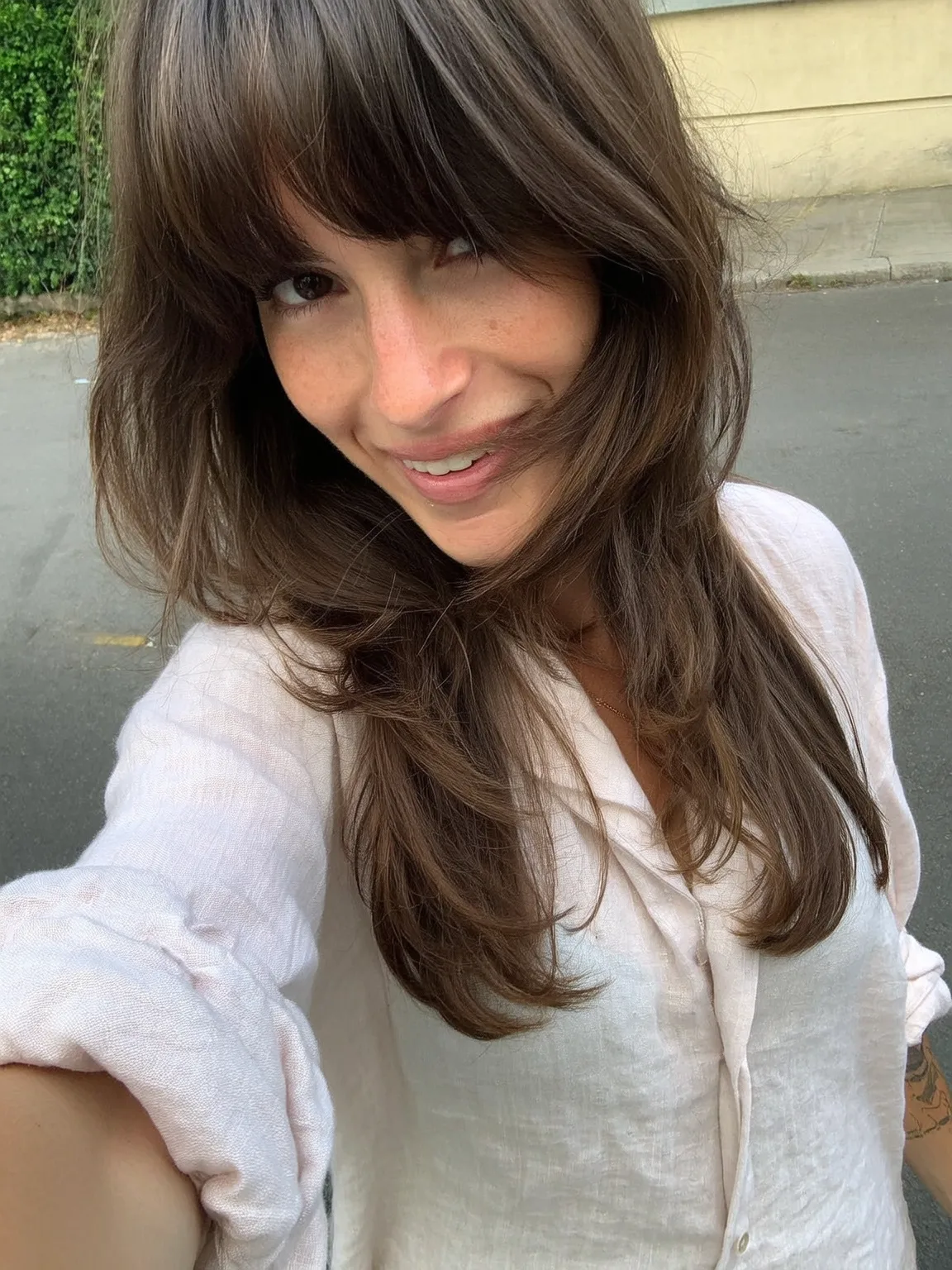 Chocolate Brown Wavy Layers with Edgy Blunt Bangs