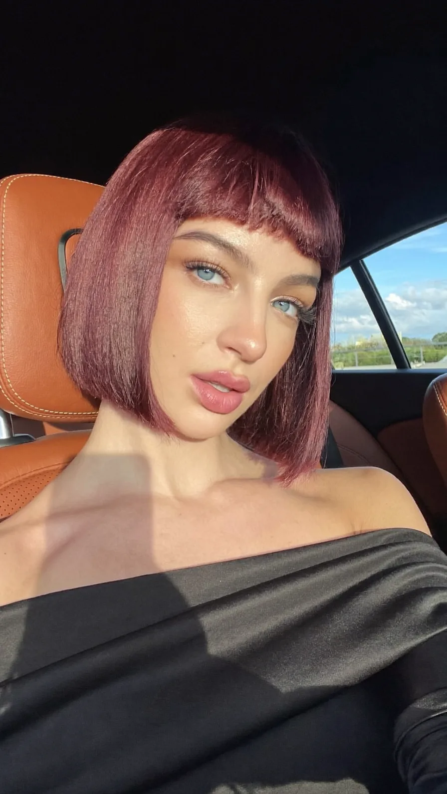Chic Chin-Length Burgundy Bob with Bold Micro Bangs