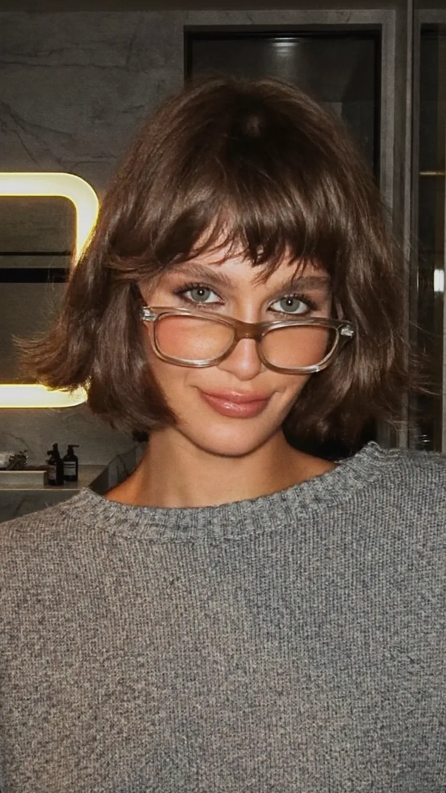 Chic Textured Bob with Wispy Bangs for Oval Faces