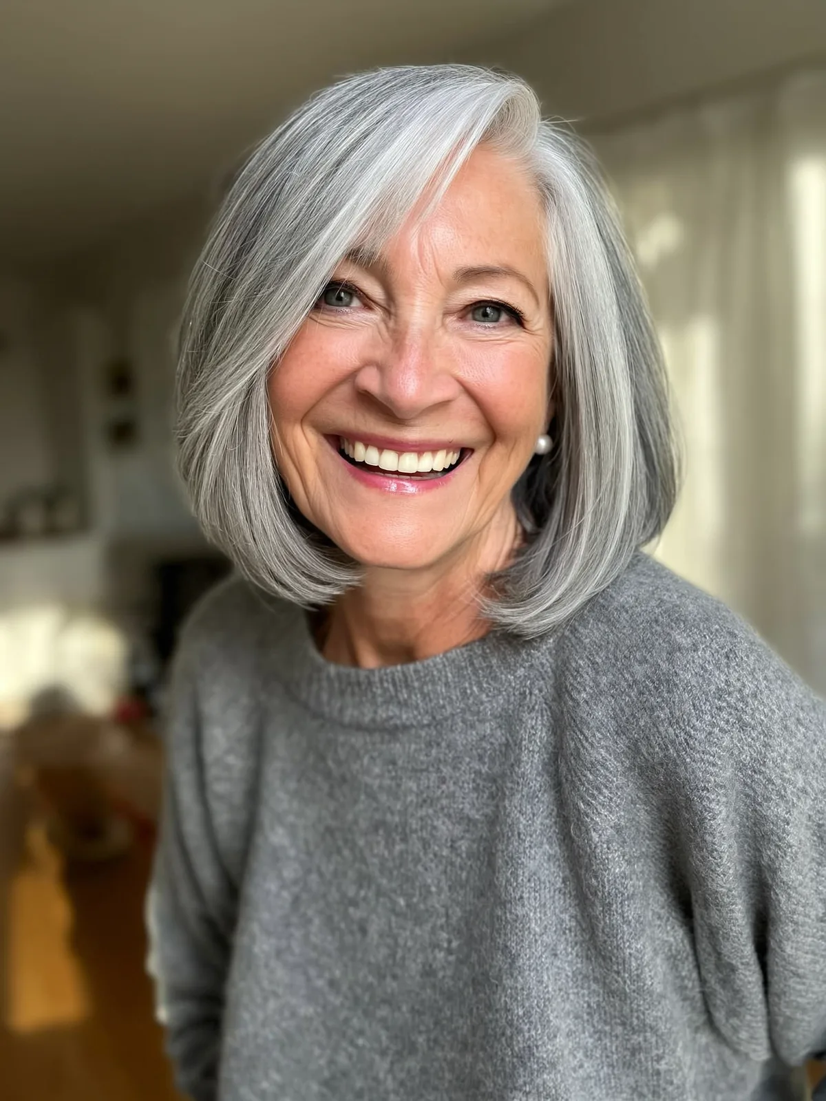 Silver Frost Bob with Side-Swept Bangs and Sleek Finish