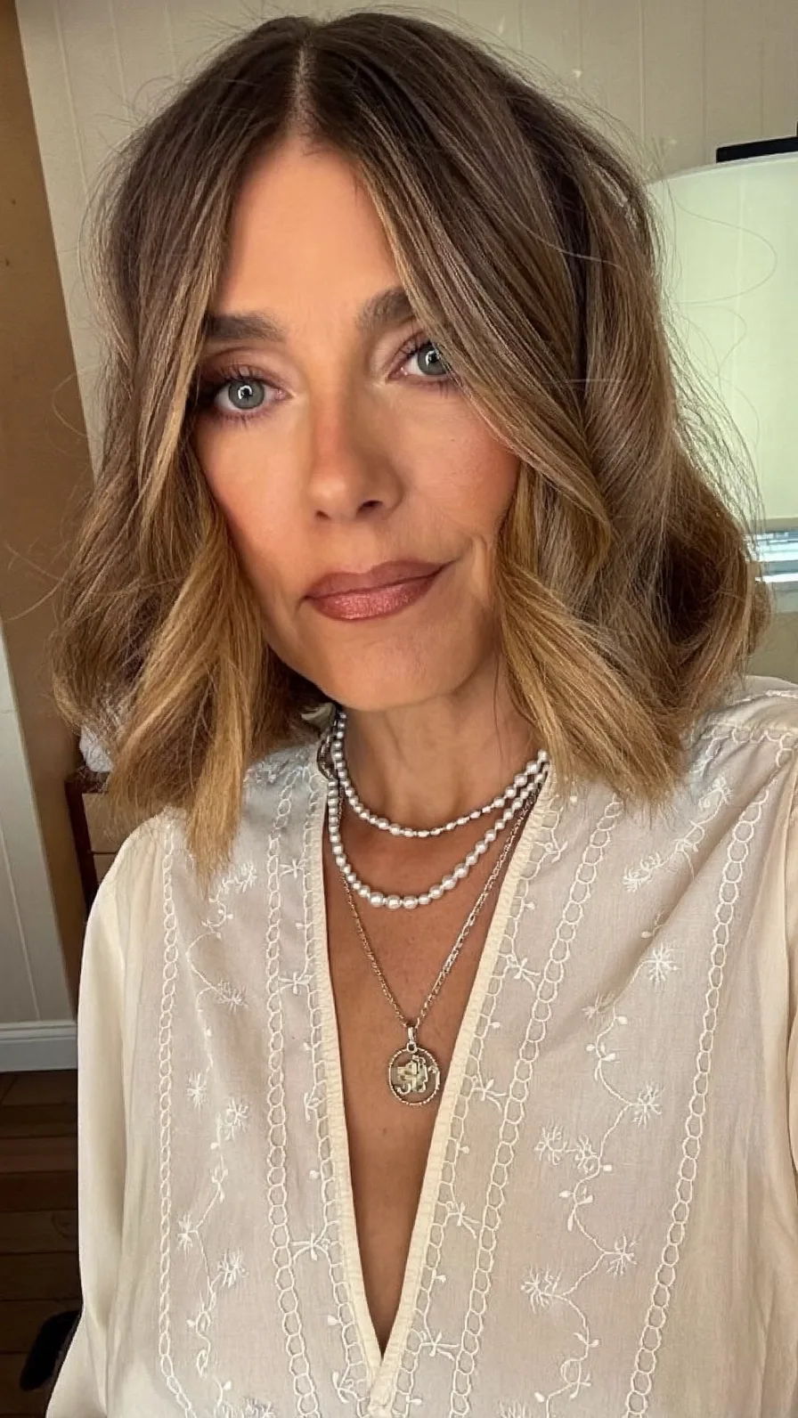 Chic Wavy Lob with Warm Caramel Balayage and Curtain Bangs