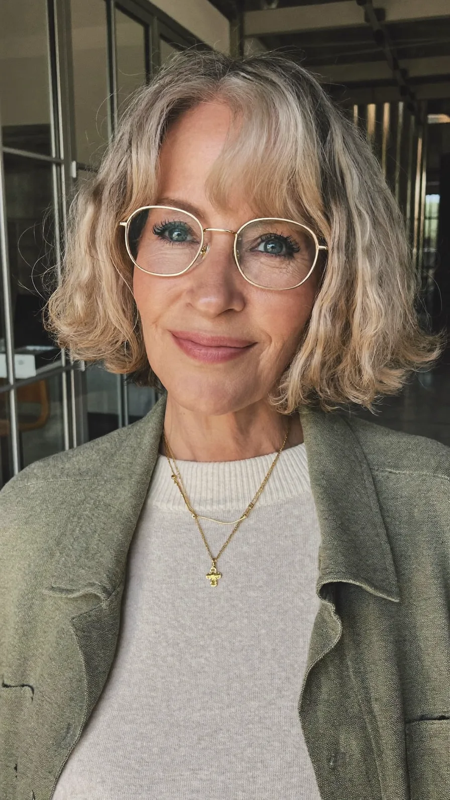 Soft Ash Blonde Wavy Chin-Length Bob with Curtain Bangs