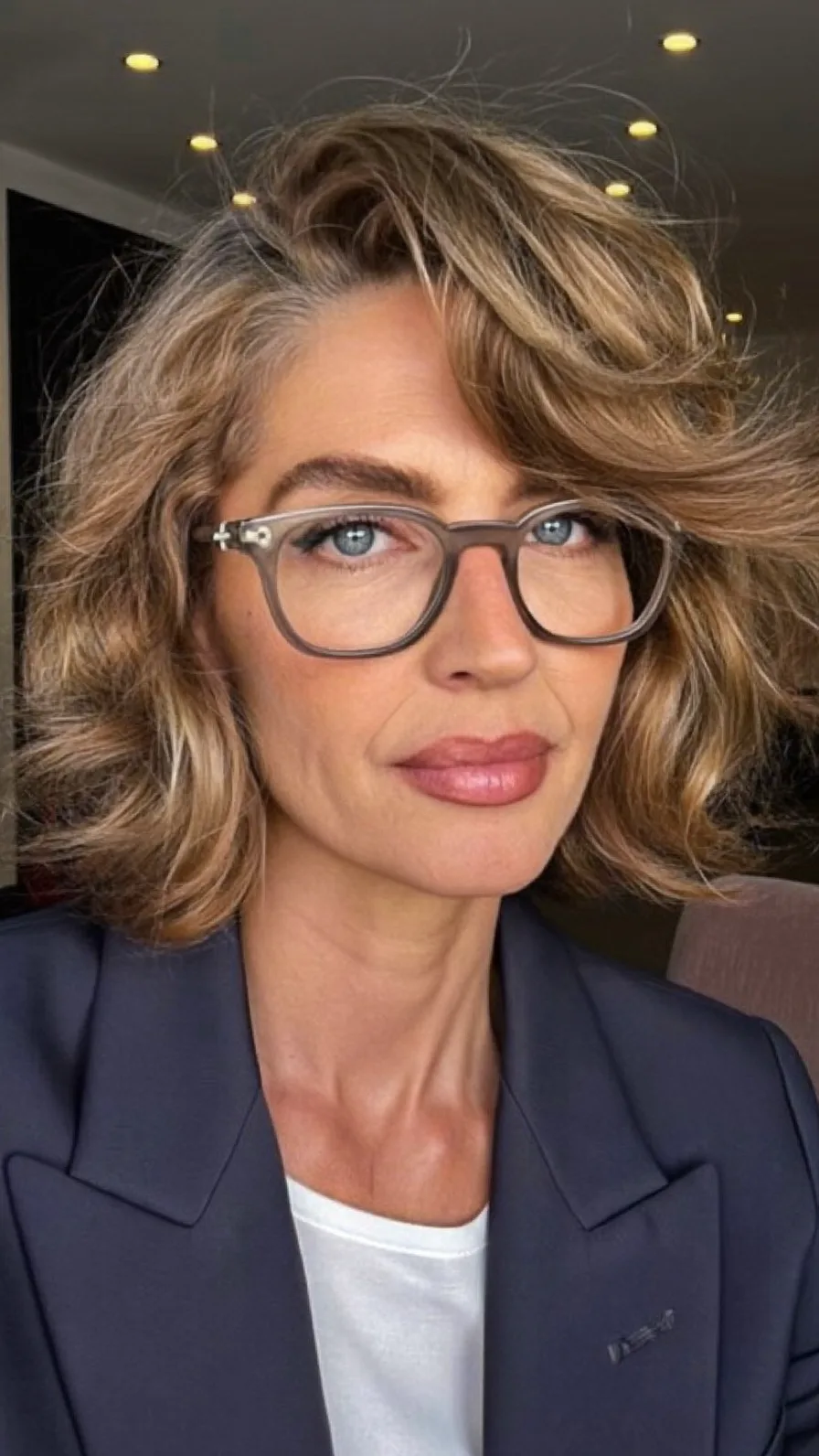 Modern Textured Layered Bob with Deep Side Part and Balayage Highlights