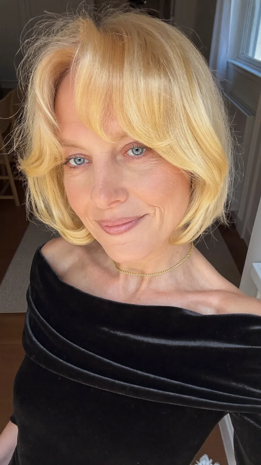 Elegant Chin-Length Bob with Curtain Bangs and Warm Blonde
