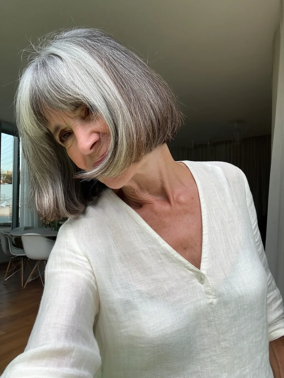 Silver-Grey Straight Bob with Soft White Highlights and Blunt Bangs