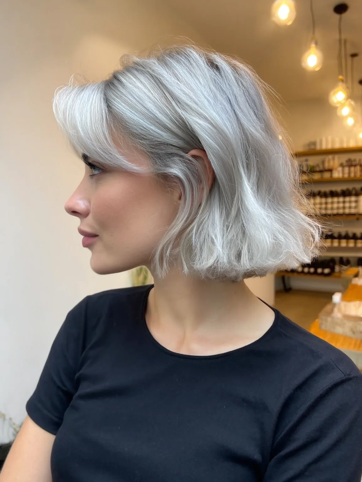 Silver Frost Wavy Bob with Side-Swept Bangs for Oblong Faces