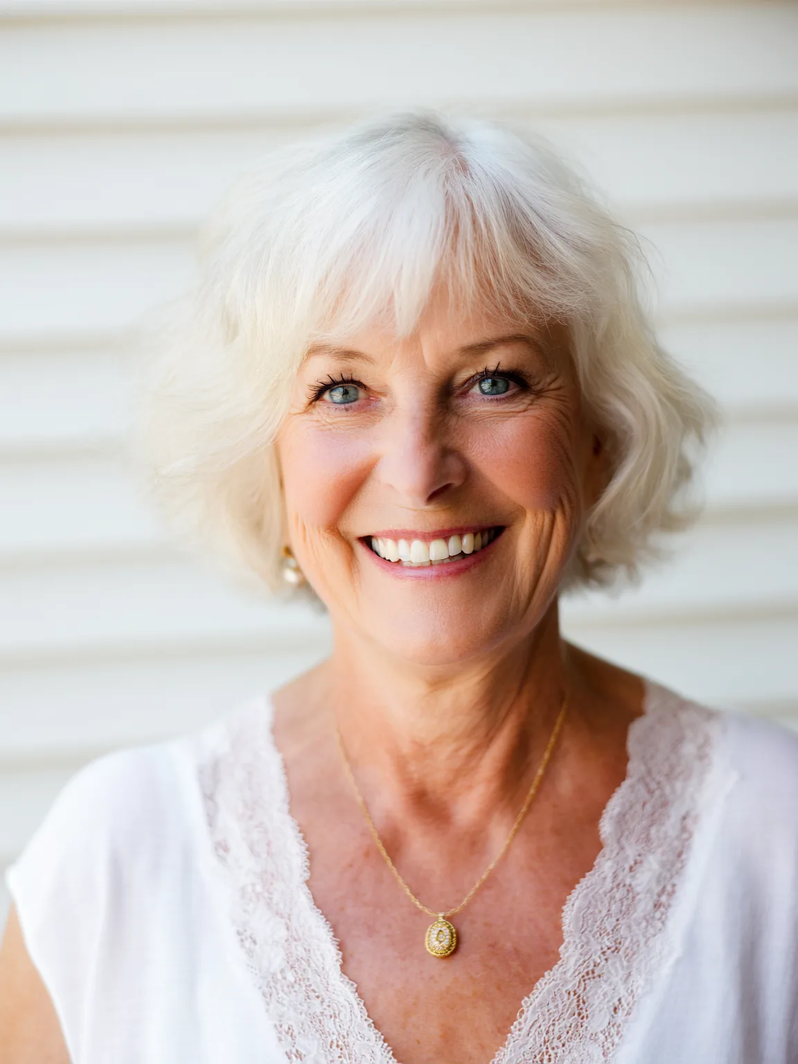 Wavy Silver Frost Bob with Wispy Bangs at Chin Length