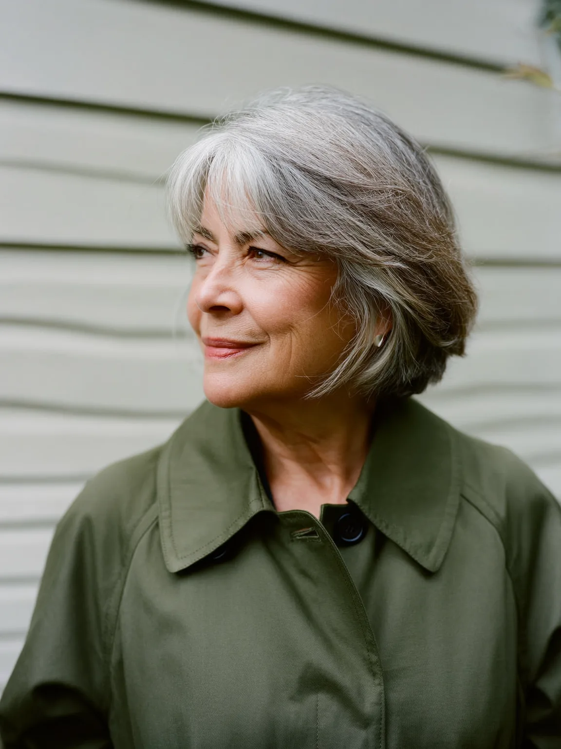 Silver Frost Chin-Length Bob with Side-Swept Bangs on Oval Face