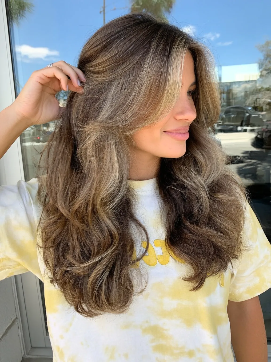 Voluminous Long Layers with Long Bangs and Ash Bronde Highlights
