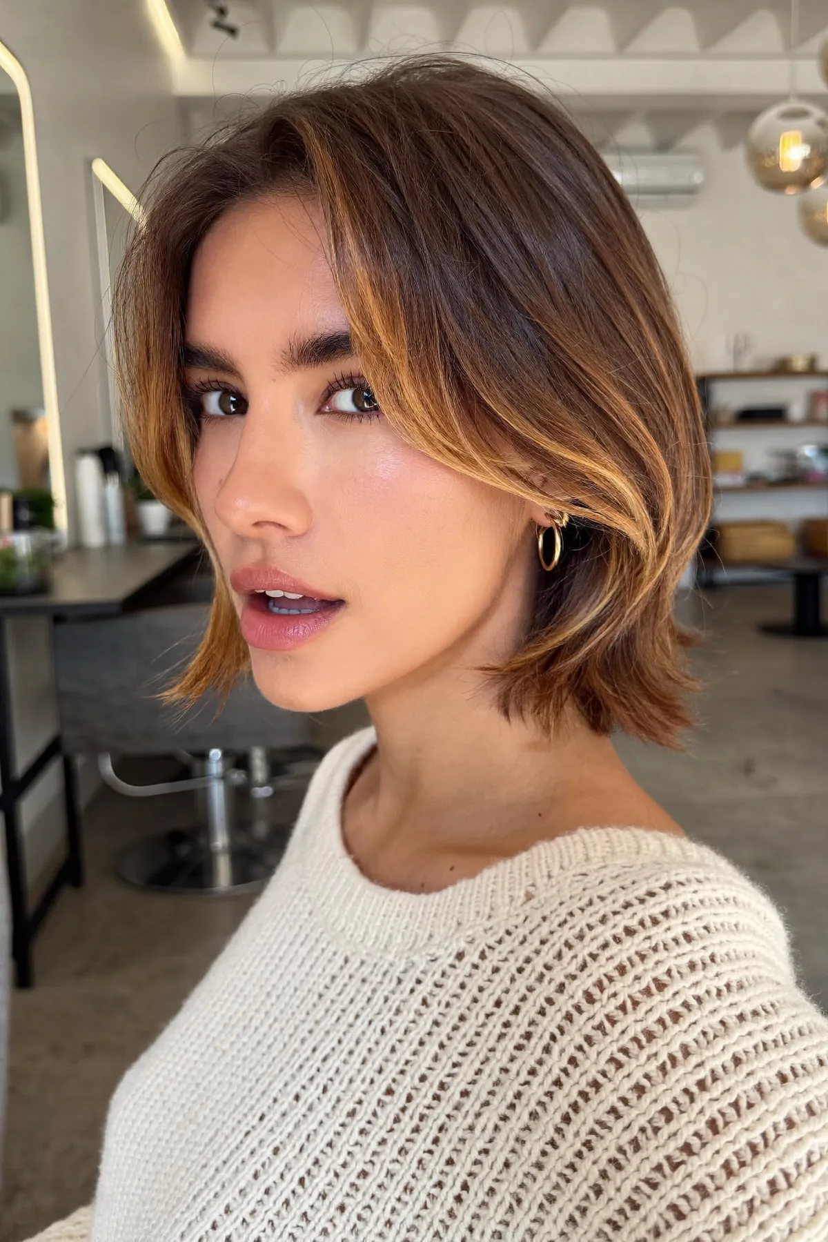 Chic Natural Brunette Chin-Length Bob with Curtain Bangs