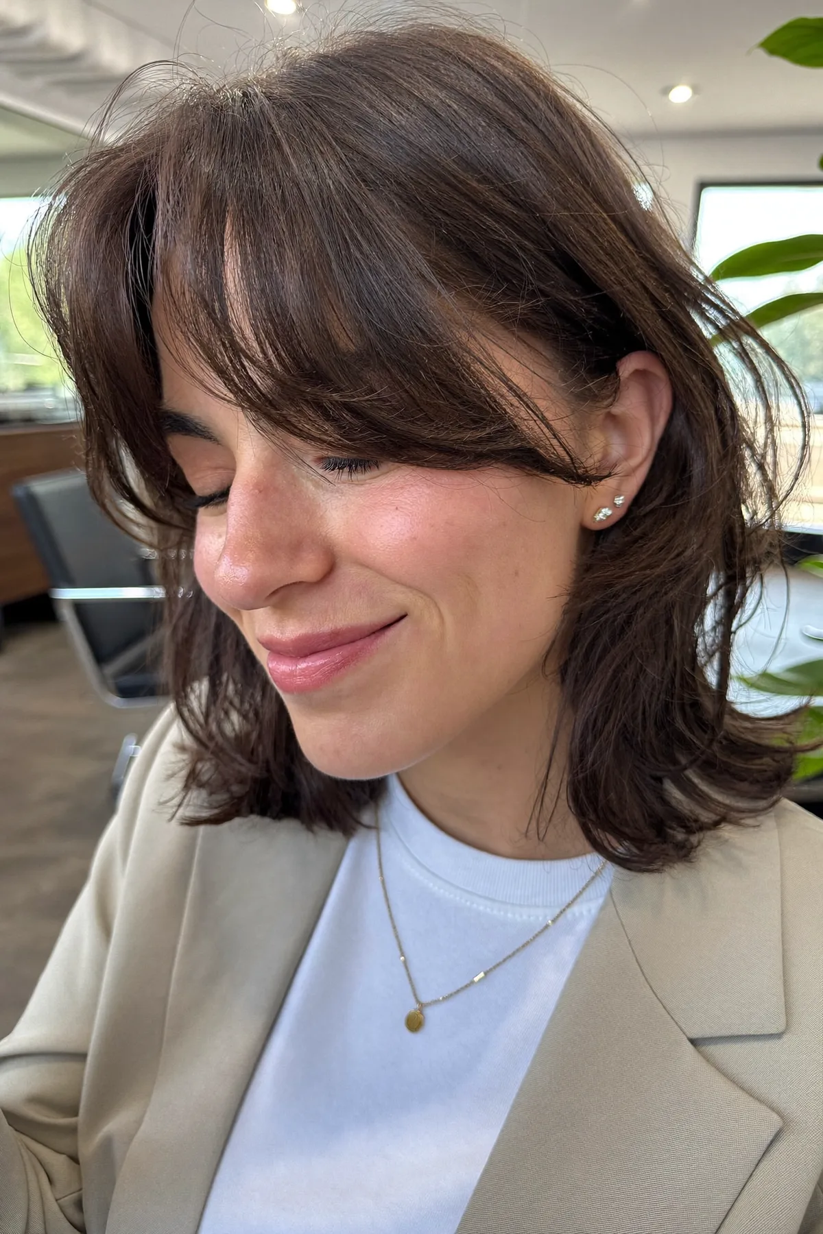 Effortless Natural Brunette Wavy Lob with Curtain Bangs