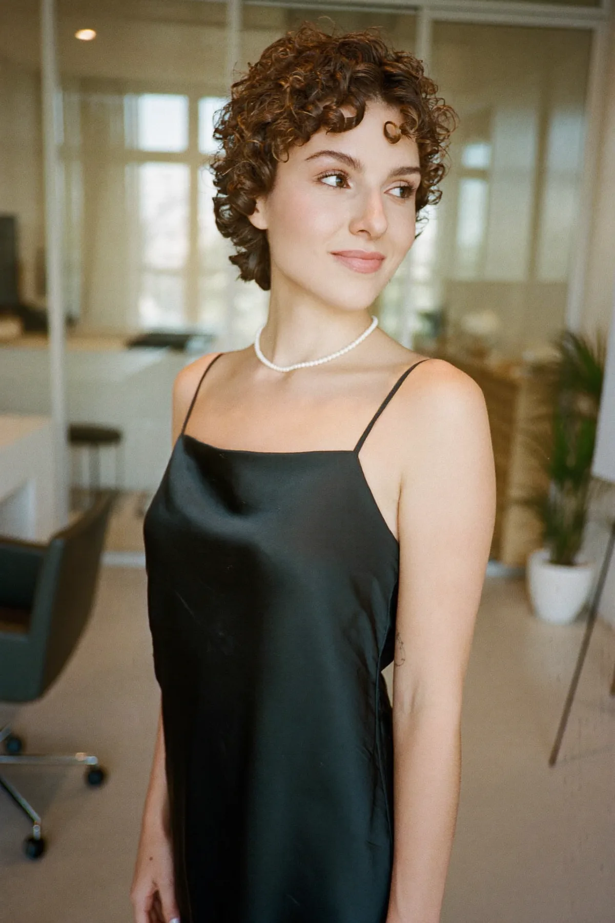 Chic Natural Brunette Curly Pixie Cut for Effortless Elegance