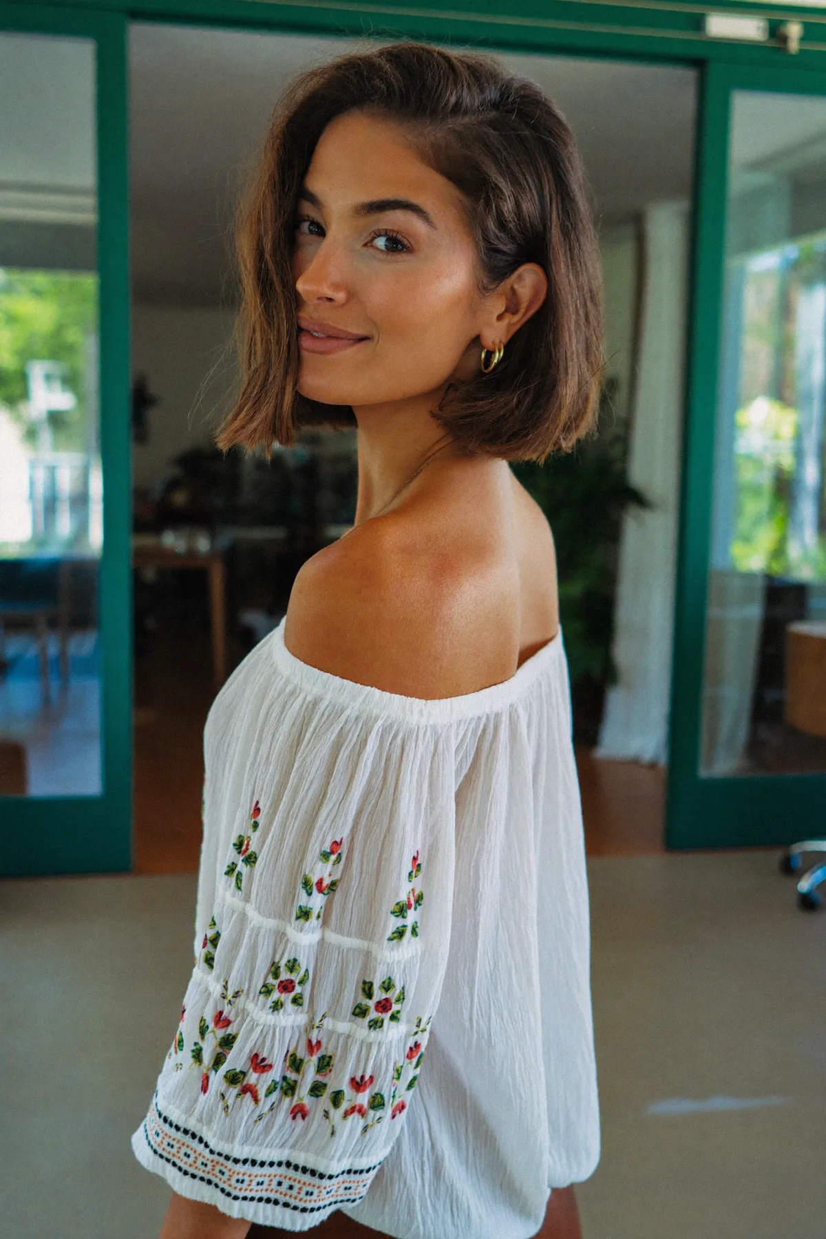 Chin-Length Natural Brunette Wavy Bob With a Glossy Finish