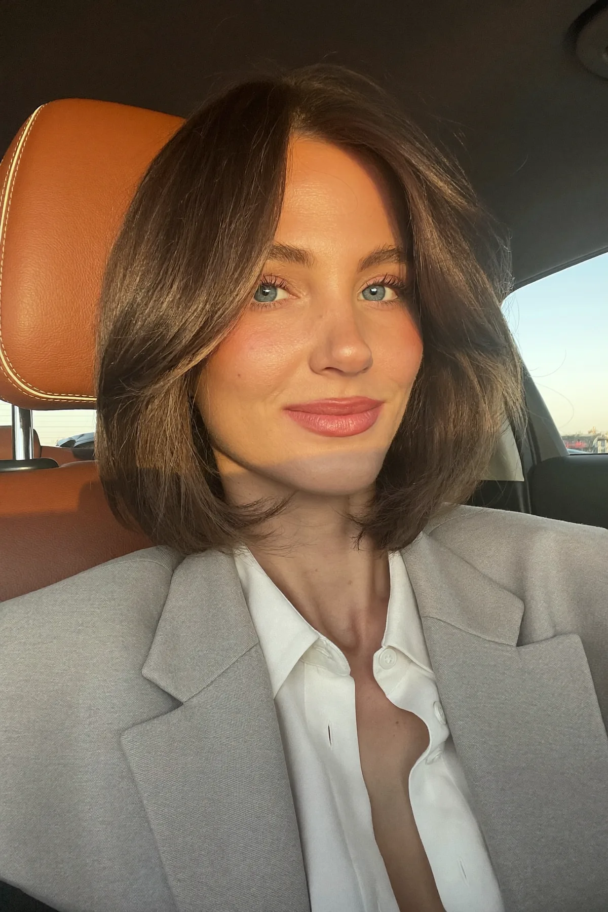 Sleek Straight Natural Brunette Chin-Length Bob with Curtain Bangs