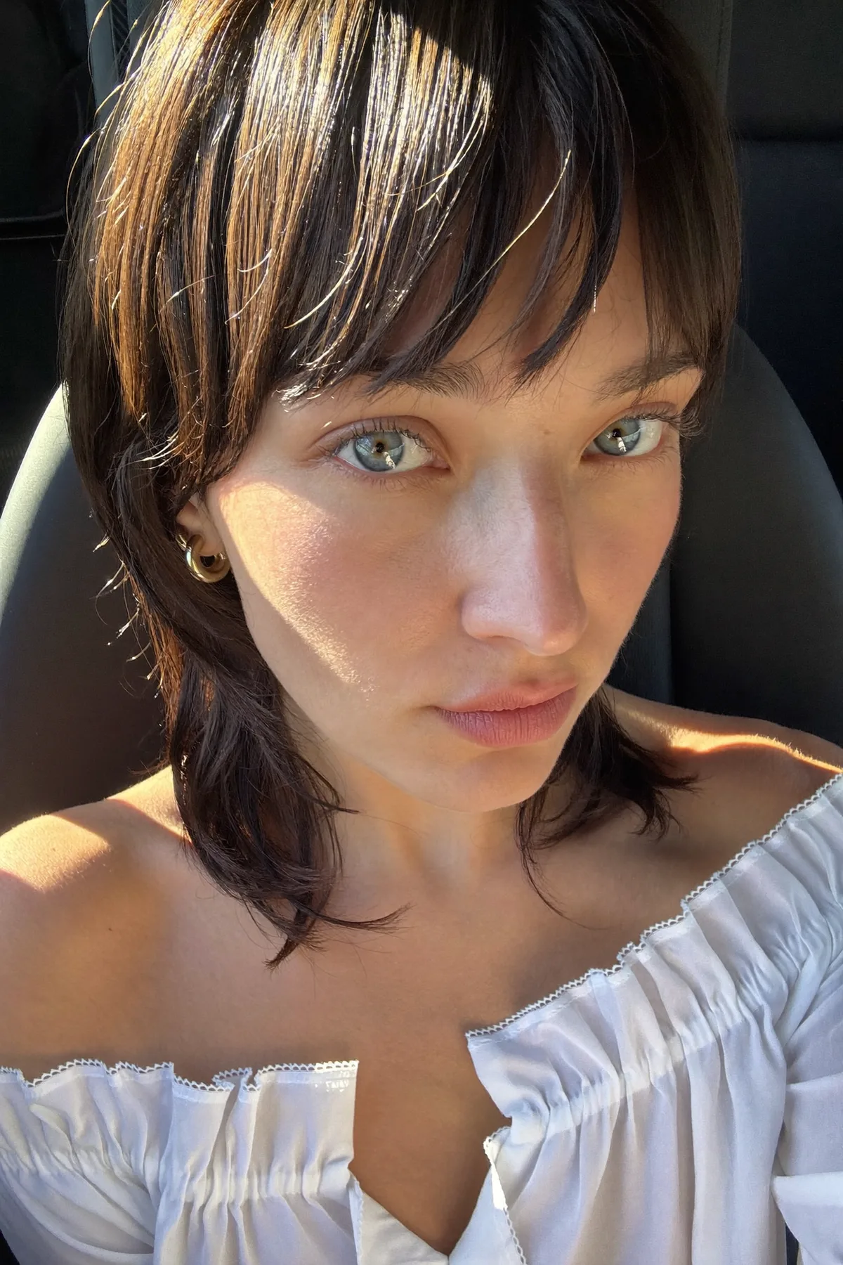 Sleek Straight Natural Brunette Shoulder-Length Shag With Curtain Bangs